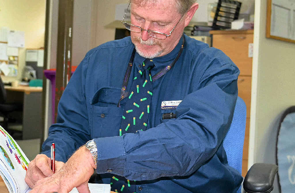 BRAIN POWER: Deputy Mayor Ross Bartley tries his hand at the NAPLAN practice test.